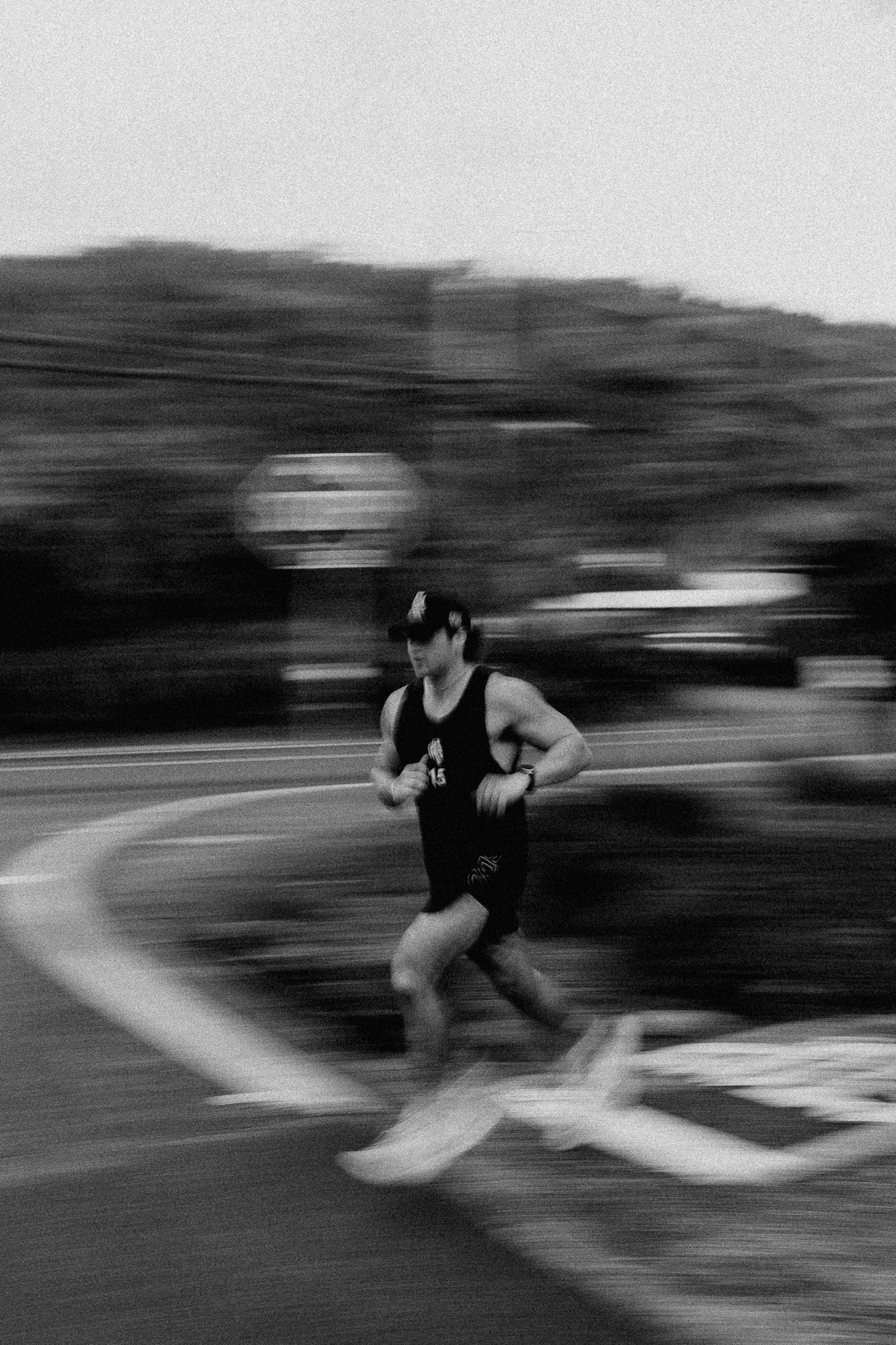 Motion-blur panning shot of a runner mid-stride
