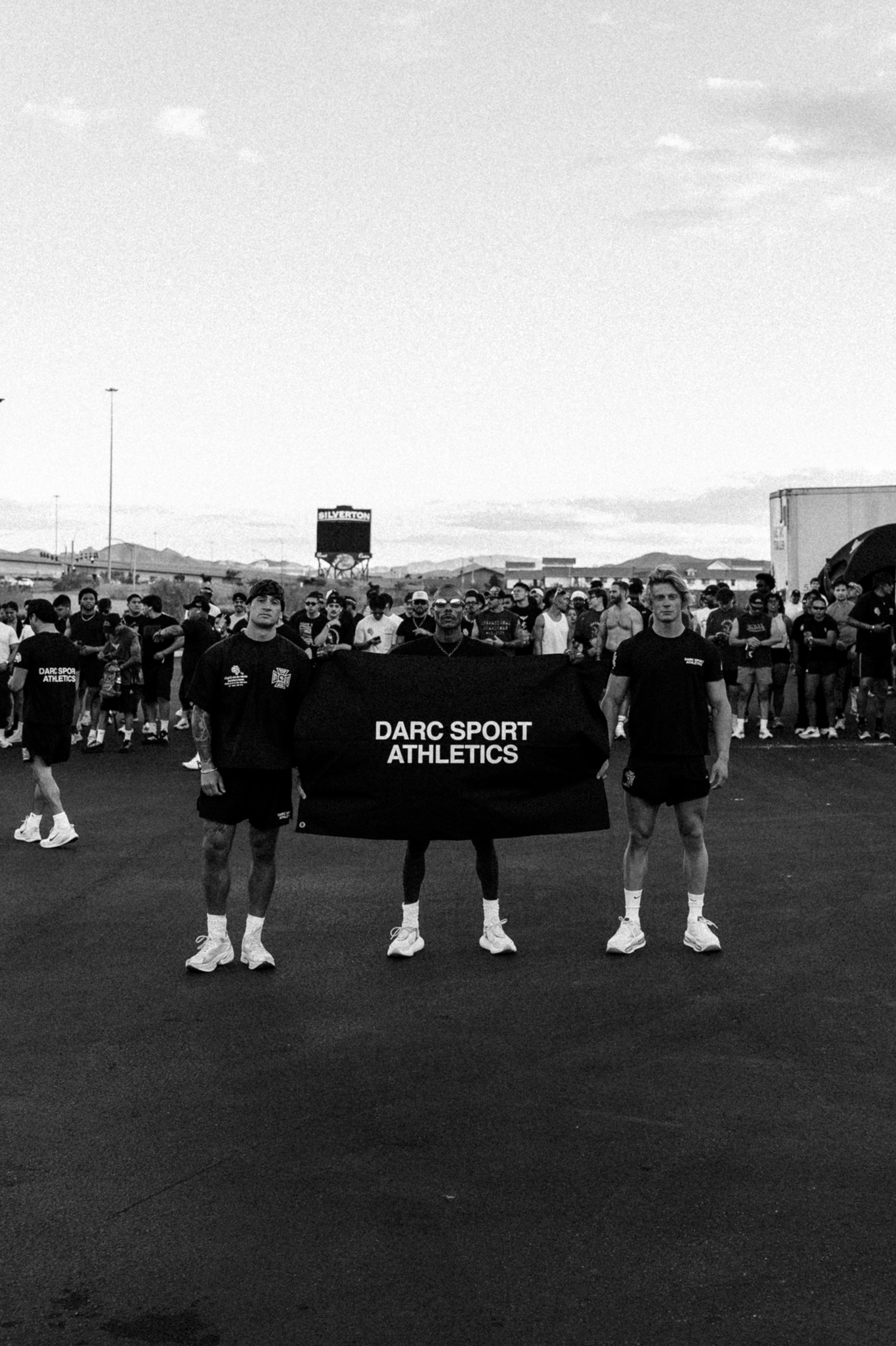 Darc Sport Athletics athletes with banner at race event